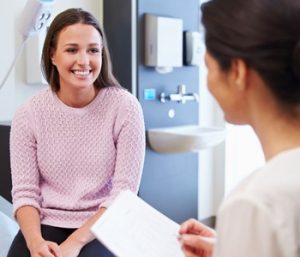 A woman consults with her provider