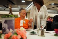 Saint Francis volunteer and Auxilian of the Year Betty Carroll (left) visits with Saint Francis Auxiliary president-elect Judi Owens