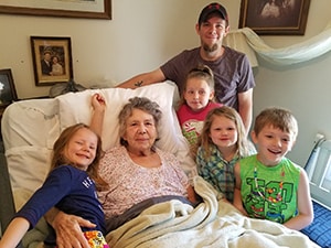 Laverne Kackley, surrounded by children from her family