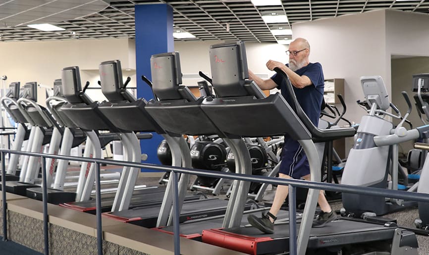 Paul Jones walks on a treadmill at Fitness Plus