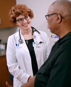 Bobbi J. Palmer, MSN, APRN, FNP-BC with a patient