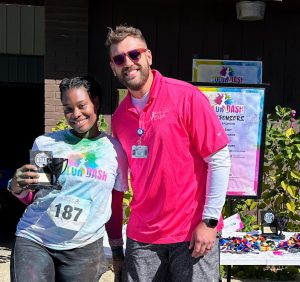 Runner and cancer survivor, Delisal Cole, is pictured with Nathan Gautier, Development Office – Special Events at Saint Francis Foundation