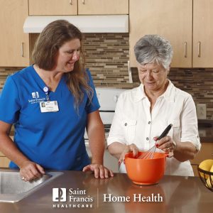 A Home Health nurse assists a patient with kitchen tasks