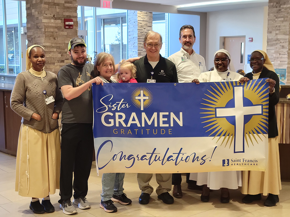 Greg Heinsman poses after receiving the Gramen Award