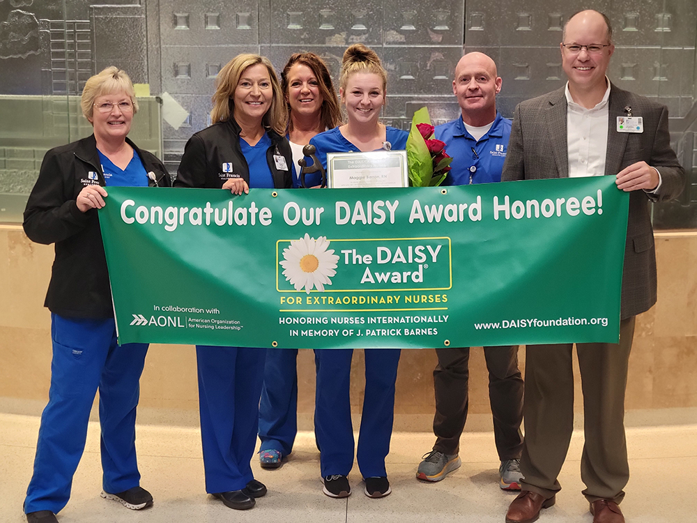 Maggie Barron, RN accepts a 2022 Daisy Award