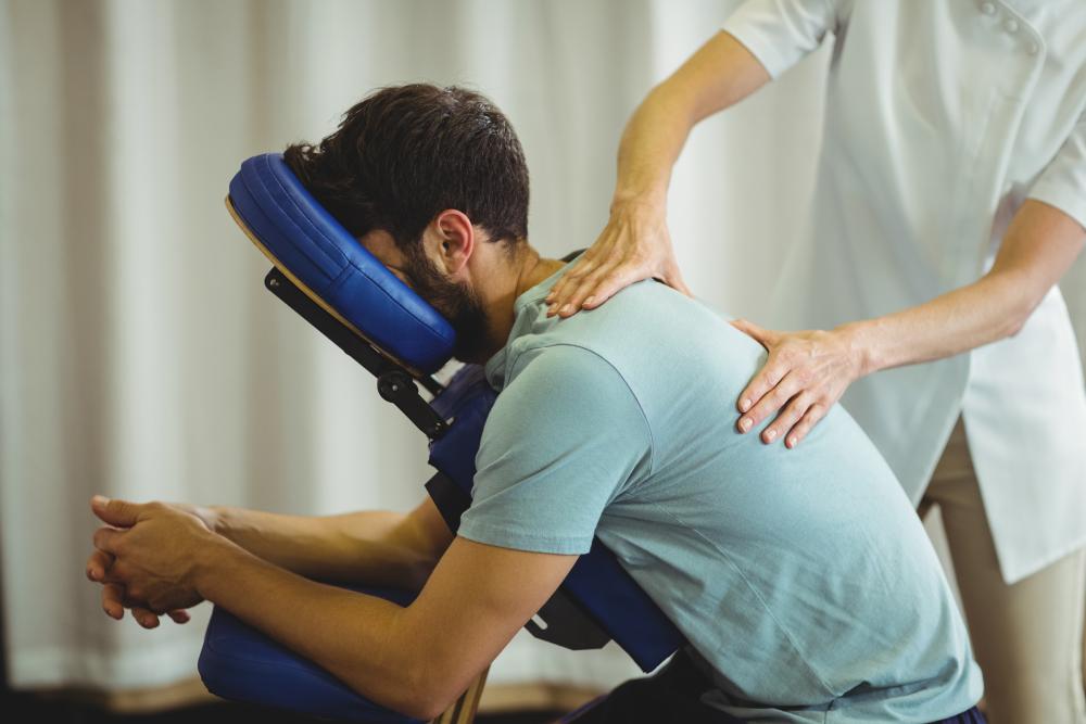 Man receiving chair massage