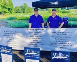 Justin Davison, President/CEO Saint Francis Healthcare, and Stacy Huff, Foundation Executive Director, greet golfers at the 2022 Friends of Saint Francis Golf Tournament
