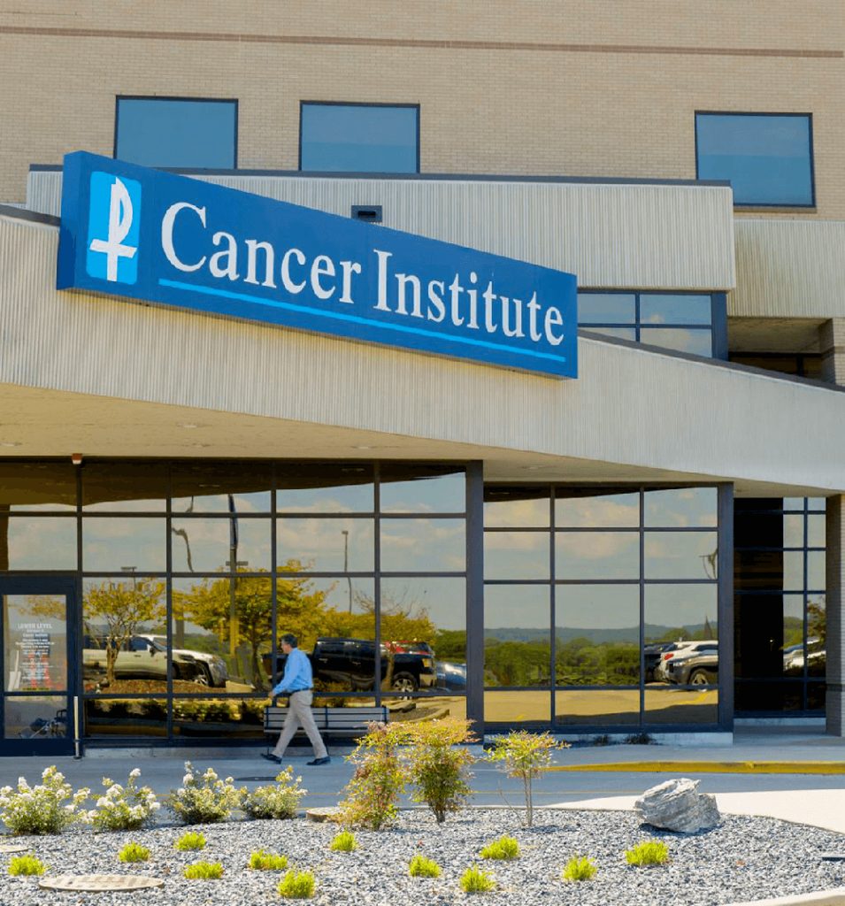 A patient walks into the Saint Francis Cancer Institute