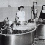 A polio patient rests in a therapy pool