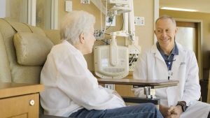 Mark A. Meadors, DO meets with a patient