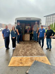 Workers load a truck with boxes from the 2025 St. Elizabeth Food Drive